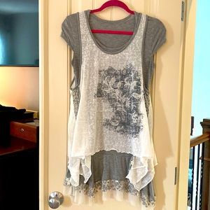Short sleeve, two piece layered tunic with lace trim. Great with leggings.